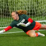 Noelle Henning warms up prior to the season opener against Xavier