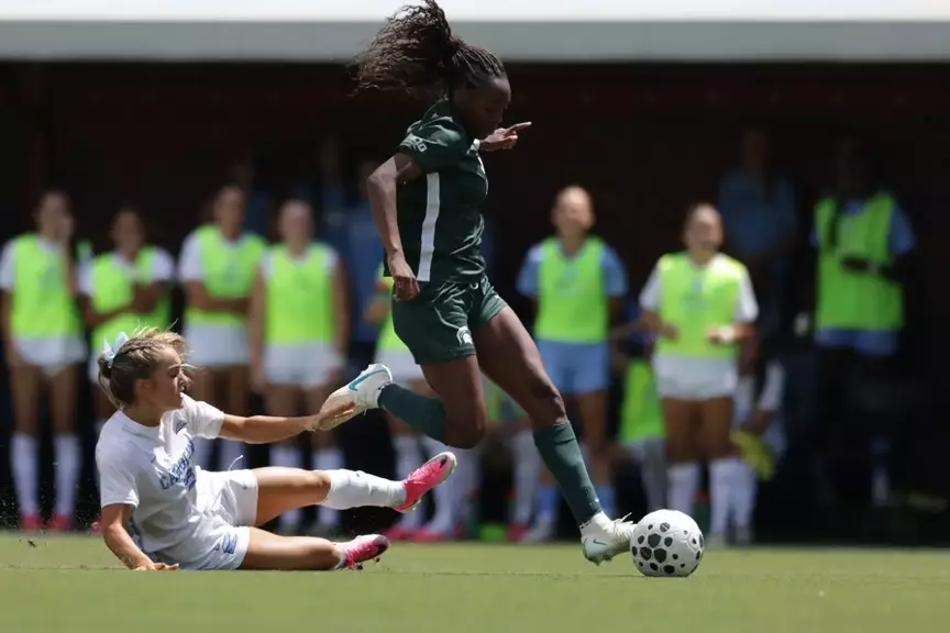 Kennedy Bell goes to goal for her first of two scores on the road at North Carolina