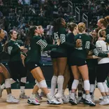 Volleyball team celebration vs. Miami
