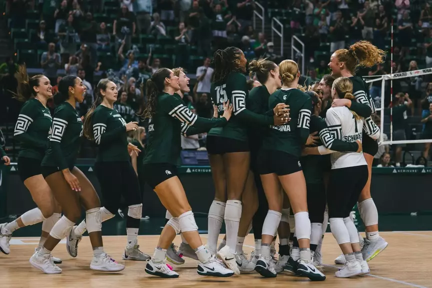 Volleyball team celebration vs. Miami