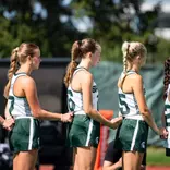 Field Hockey team pauses for the National Anthem pre-game