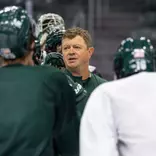Head Coach Adam Nightingale speaks to the team at practice