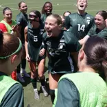 Ella Janz Hypes her teammates in advance of a game at North Carolina