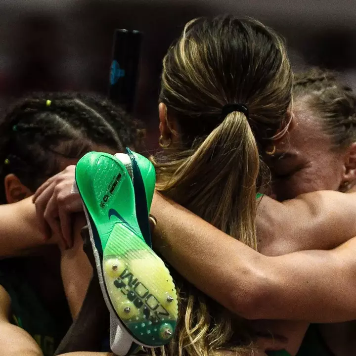 Women's DMR celebration hug (March 13)