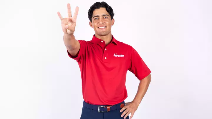 Sebastian Gamboa holds up the Coog sign