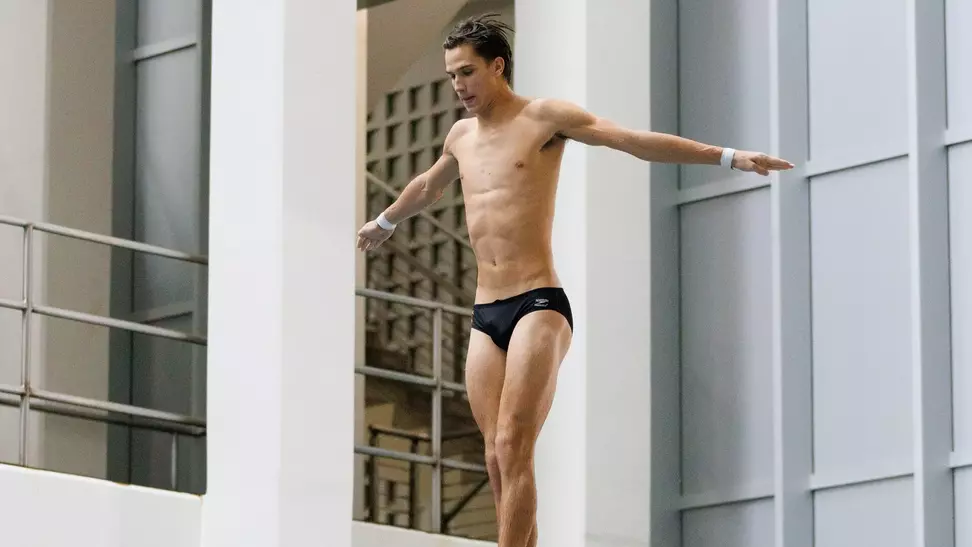 Bennett Greene Dives on 3-meter Springboard in Competition at Allan Jones Intercollegiate Aquatic Center