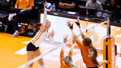Maggie Dostic Rises for Attack in Match against Texas