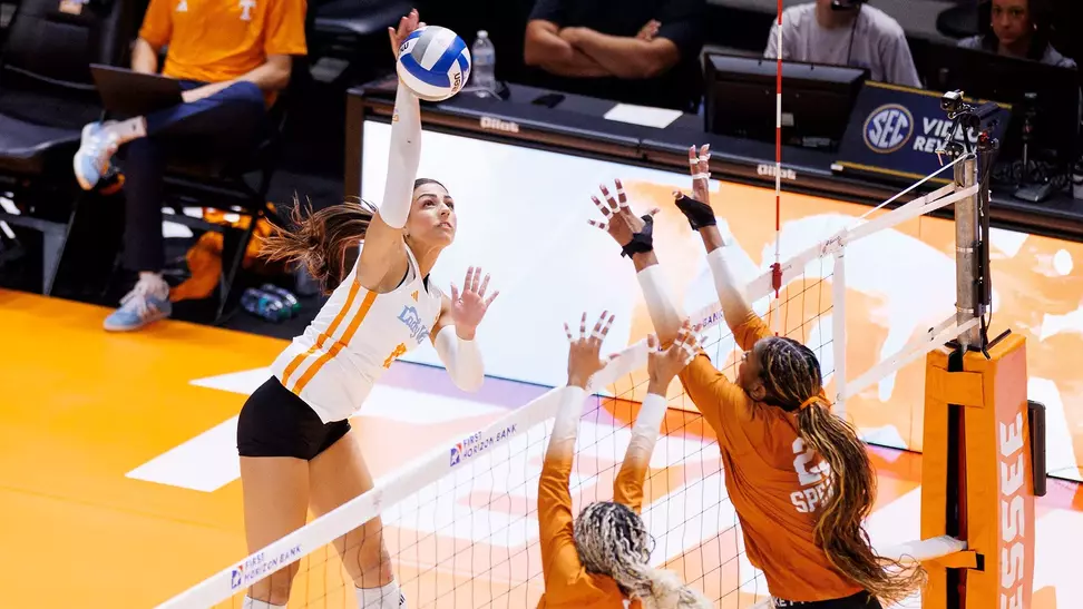 Maggie Dostic Rises for Attack in Match against Texas