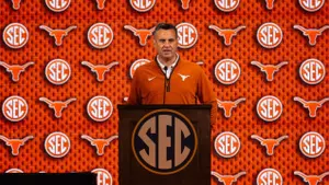 Coach Miller at podium during 2026 SEC Media Day