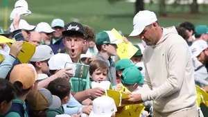 AUGUSTA, GEORGIA - APRIL 06: Scottie Scheffler of the United States signs autographs for patrons during a practice round prior to the 2026 Masters Tournament at Augusta National Golf Club on April 06, 2026 in Augusta, Georgia. (Photo by Andrew Redington/Getty Images)
