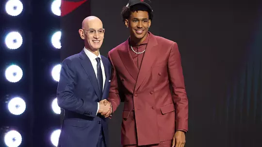 NEW YORK, NEW YORK - JUNE 23: NBA commissioner Adam Silver shakes hands with Dailyn Swain after he is drafted fifteenth overall by the Chicago Bulls during Round One of the 2026 NBA Draft at Barclays Center on June 23, 2026 in New York City. (Photo by Arturo Holmes/Getty Images)