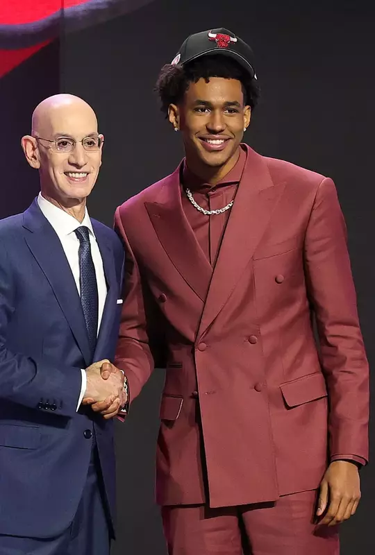 NEW YORK, NEW YORK - JUNE 23: NBA commissioner Adam Silver shakes hands with Dailyn Swain after he is drafted fifteenth overall by the Chicago Bulls during Round One of the 2026 NBA Draft at Barclays Center on June 23, 2026 in New York City. (Photo by Arturo Holmes/Getty Images)