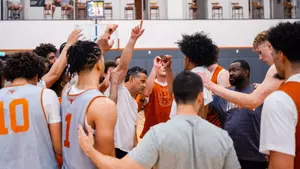 Men's Basketball team huddle during summer practice 2026