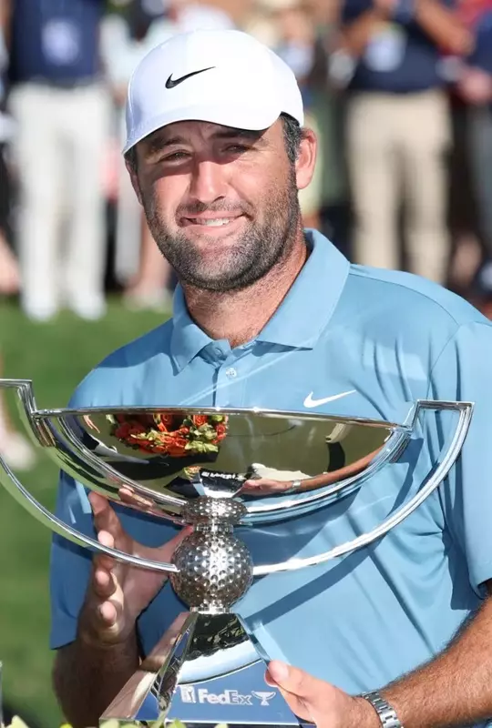 ATLANTA, GEORGIA - AUGUST 30: Scottie Scheffler of the United States lifts the trophy after winning the final round of the TOUR Championship 2026 at East Lake Golf Club on August 30, 2026 in Atlanta, Georgia. (Photo by Kevin C. Cox/Getty Images)