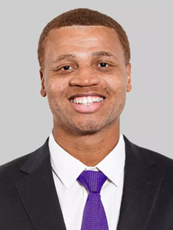 Joel Filani purple tie head shot 2025