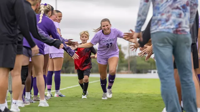 Gracie Kelly runs through the pregame tunnel before ACU's matchup with Central Arkansas at Elmer Gray Stadium on Oct. 4, 2026.