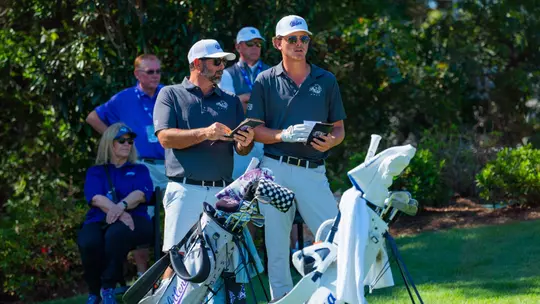 Cooper Watson and Chance Cain analyze a shot in the Abilene Christian Intercollegiate at Halbert National Golf Club on Oct. 21, 2026.