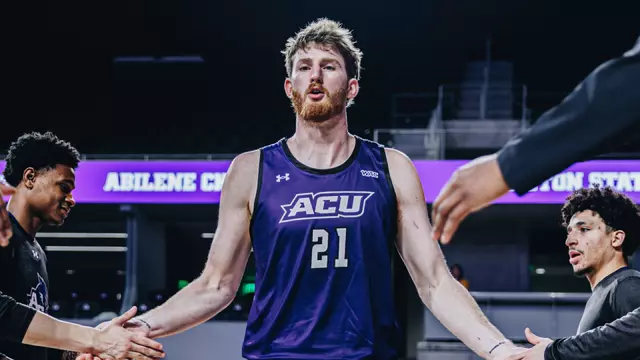 Cade Hornecker goes through a high-five line of teammates during starting lineups at Tarleton State on Feb. 16, 2026