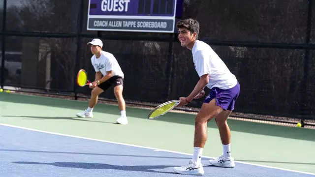 Luis Jose Nakamine and Ethan Scribner prepare for their doubles point.