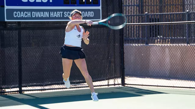 Elsa Luthar returns the ball to her opponent.