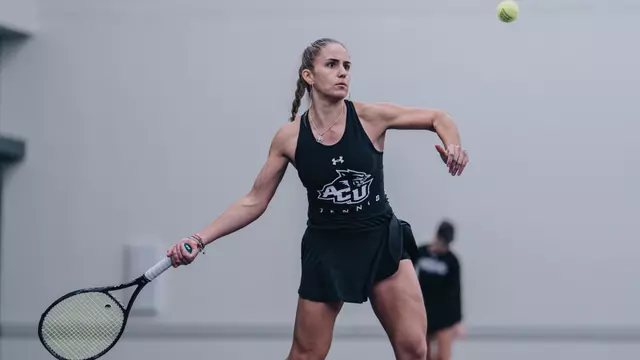 Maria Cascos returns a ball to her opponent.