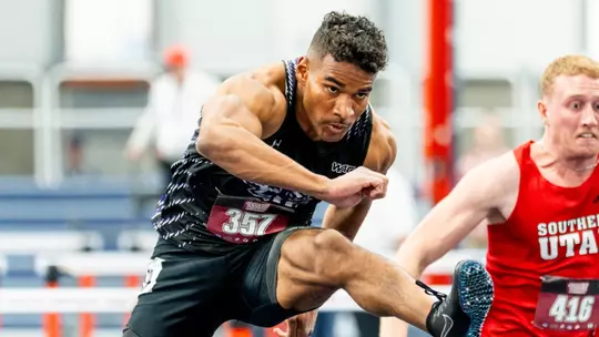 Canaan Fairley runs in the hurdles as part of the men's heptathlon in the WAC Indoor Championships