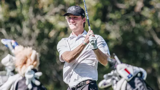 Tres Hill watches his ball at an ACU men's golf practice in Abilene, Texas on Sept. 11, 2025.