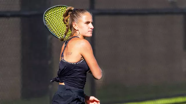 Maria Cascos watches as her opponent returns the ball.