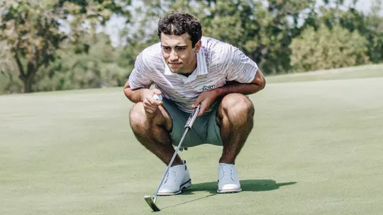 Grégoire Hoyeau examines a putt at an ACU men's golf practice at Abilene Country Club on Sept. 11, 2025.