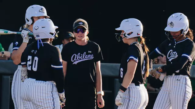 ACU softball coach Jo Koons talks with players during a game at North Texas on March 25, 2026