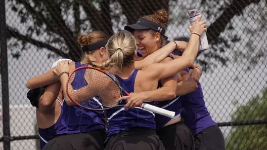 ACU women's tennis players celebrate a win in the WAC Tournament semifinal over Utah Tech on April 17, 2026