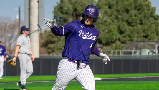 Grant Watkins points to the dugout after hitting a home run in ACU's 8-7 win over Oral Roberts at Crutcher Scott Field at Bullock Brothers Ballpark on Feb. 22, 2026.