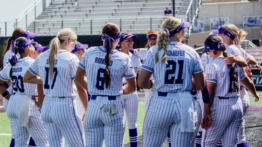 ACU softball team huddles up before a game against California Baptist on April 25, 2026
