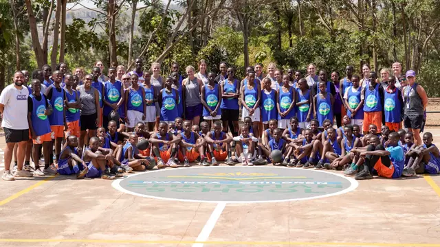 ACU women's basketball poses with students at Rwanda Children following its basketball clinic on Aug. 13, 2026.