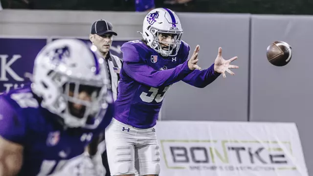 Hugo Nash prepares to catch the snap and punt against Austin Peay in September 2025