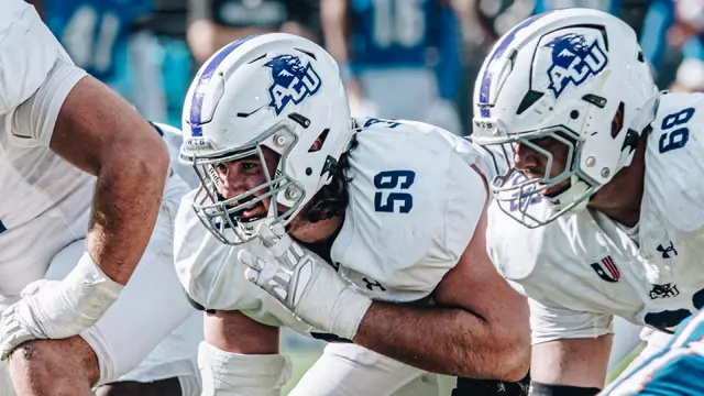 Landon Roaten (59) prepares for a snap at right guard, next to center Colter Lynch (68) during a game at West Georgia.