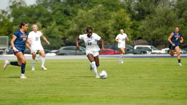 Nia Leslie dribbles past defenders in a game against UTEP on August 23, 2026.