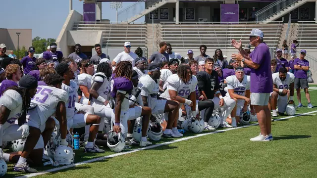 Head coach Keith Patterson talks to his football team after a practice on August 15, 2026