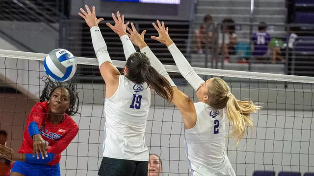 Maddie Finnegan and Avery Thaler attempt to block an attack in ACU's 3-0 win over Louisiana Tech at Moody Coliseum on Sept. 17, 2026.