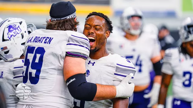 Landon Roaten hugs Dillon Williams, who yells in excitement, after ACU's 41-39 win at Idaho on Sept. 19, 2026