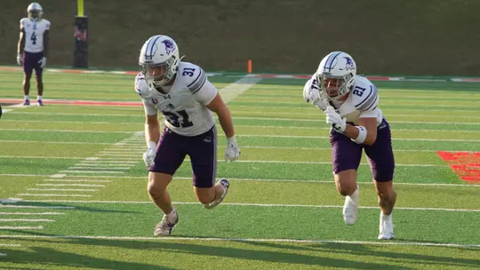 Trace Low and Carson Finney run during punt block at Lamar on August 29, 2026