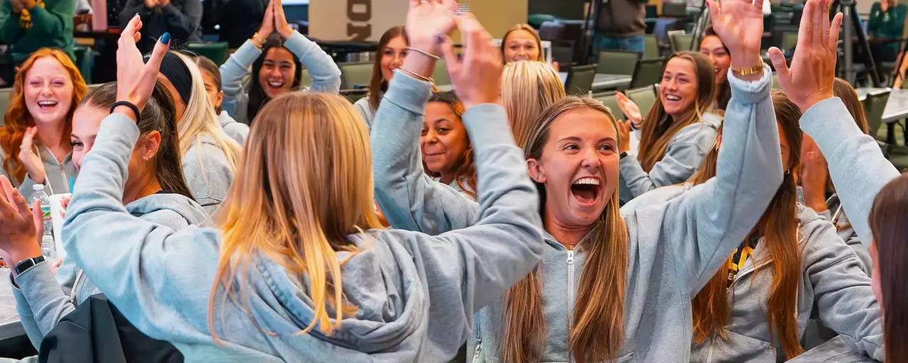 Soccer players are cheering after NCAA Tournament bid announcement