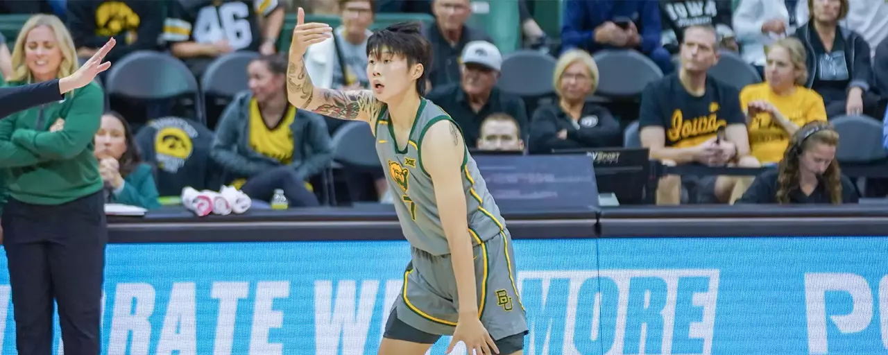 Yuting Deng dribbles the ball against Davidson