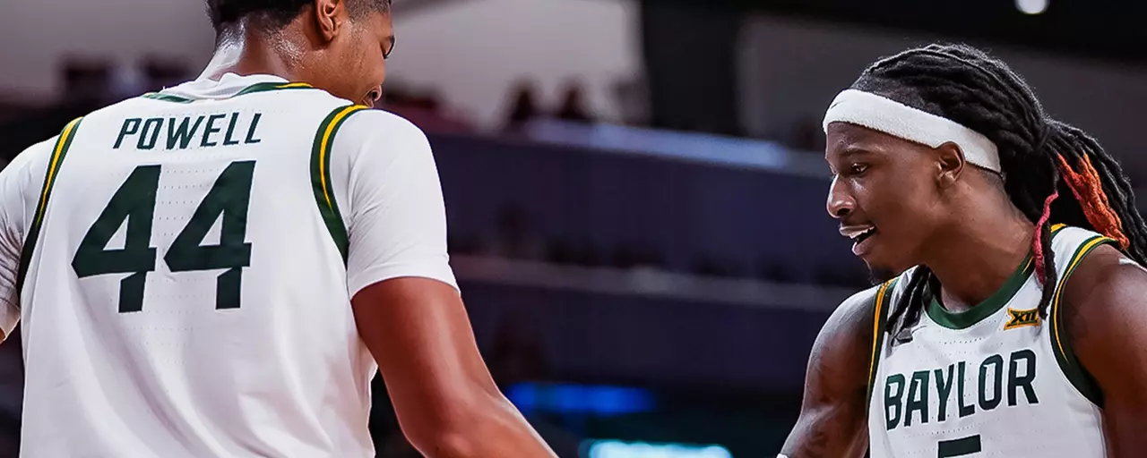 Obi Agbim and Caden Powell High Five during a game
