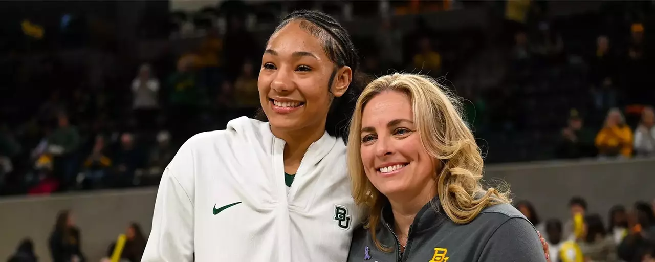 Darianna Littlepage-Buggs smiles next to Coach Collen during a ball presentation on Jan. 27, 2026
