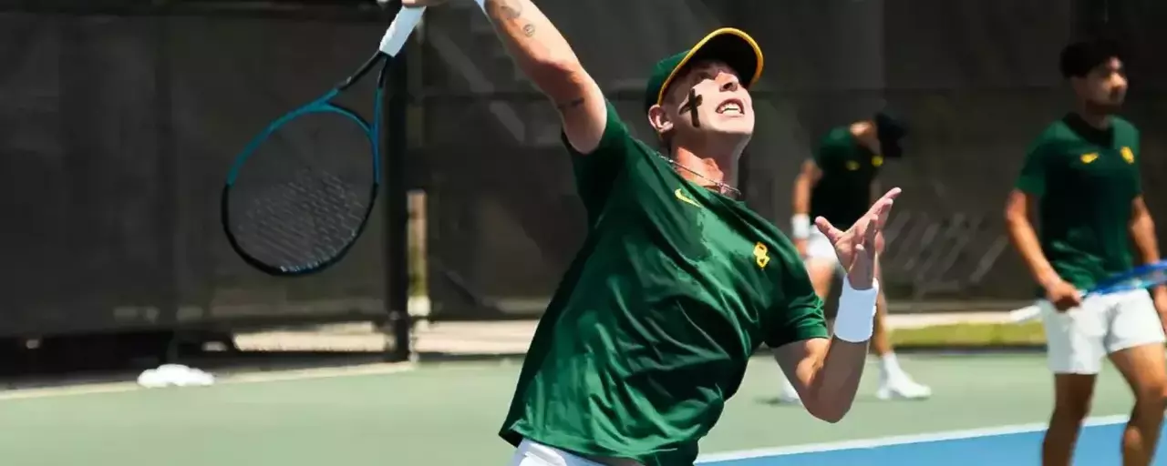 Alex Chirita hits a ball overhead during a men's tennis match in Orlando