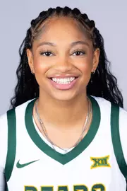 Taliah Scott headshot in white uniform in front of white backdrop