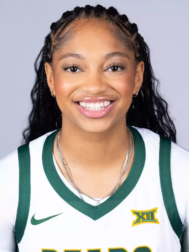 Taliah Scott headshot in white uniform in front of white backdrop