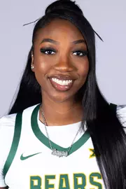 Lorena Awou headshot in white uniform in front of white backdrop