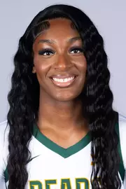 Kyla Abraham headshot in white uniform in front of white backdrop